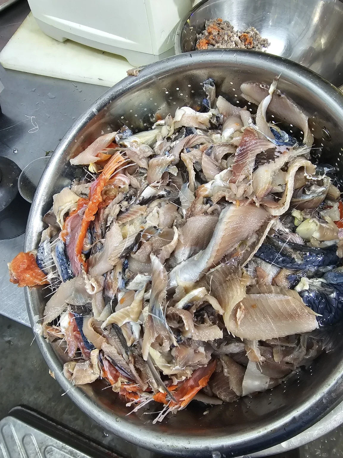 Food-grade fish trim and side streams prepared for controlled processing
